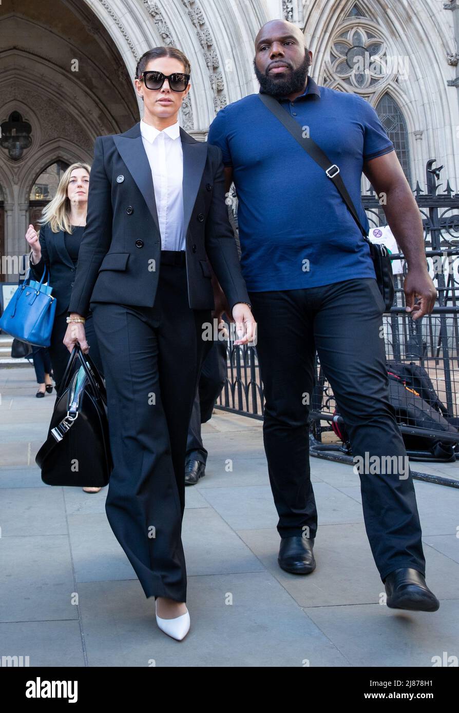 London, UK. 13th May, 2022. Rebekah Vardy leaves The Royal Courts of Justice after her libel case with Coleen Rooney, Coleen Rooney who is the wife of Derby County manager and former England football player Wayne Rooney, and Rebekah Vardy, wife of Leicester City striker Jamie Vardy are locked in a libel battle also known as the 'Wagatha Christie' trial after accusations that Mrs Vardy leaked false stories about Mrs Rooney to the press. Credit: Lucy North/Alamy Live News Stock Photo