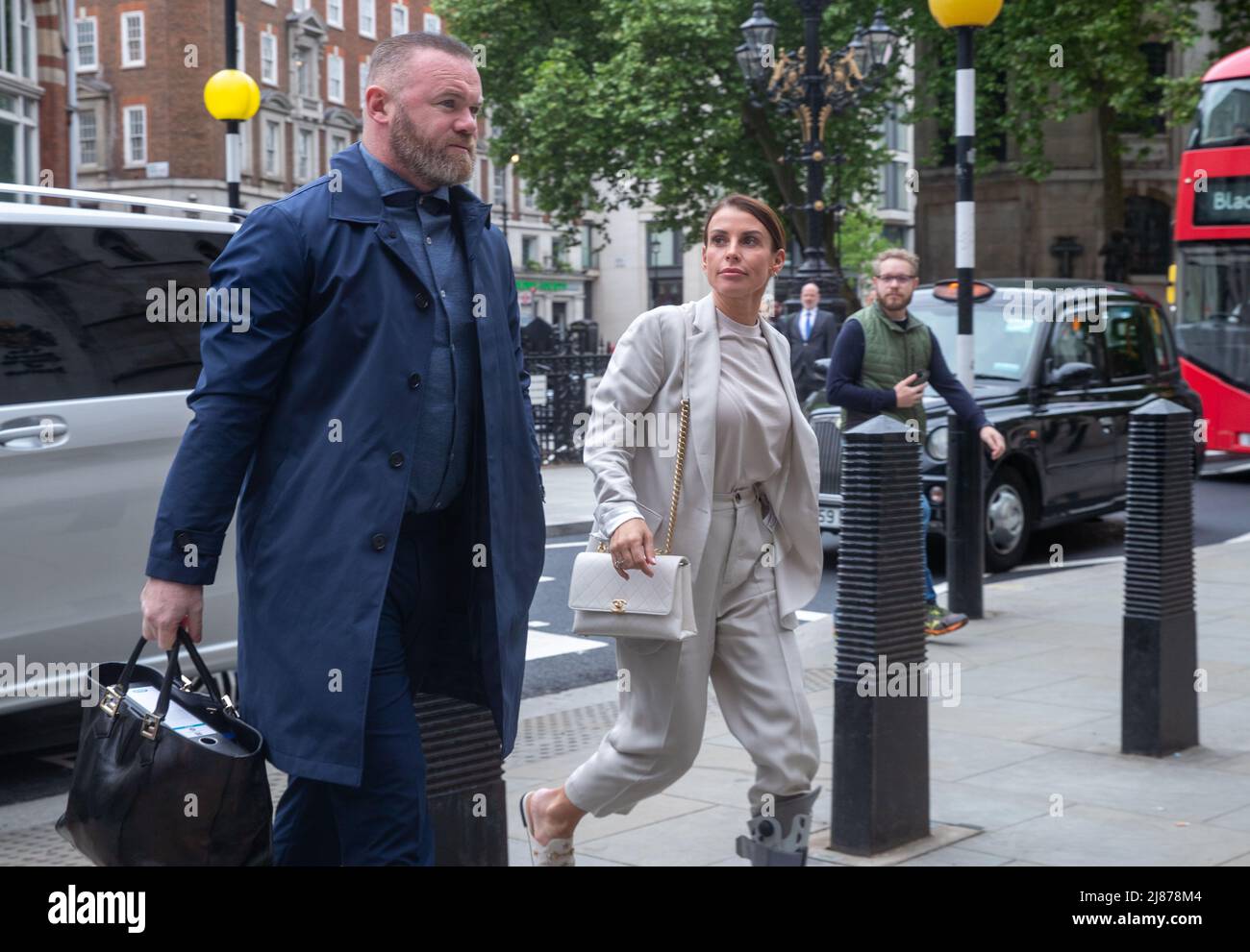 London, UK. 13th May, 2022. Coleen Rooney arrives at The Royal Courts of Justice for her libel case with Rebekah Vardy, Coleen Rooney who is the wife of Derby County manager and former England football player Wayne Rooney, and Rebekah Vardy, wife of Leicester City striker Jamie Vardy are locked in a libel battle also known as the 'Wagatha Christie' trial after accusations that Mrs Vardy leaked false stories about Mrs Rooney to the press. Credit: Lucy North/Alamy Live News Stock Photo