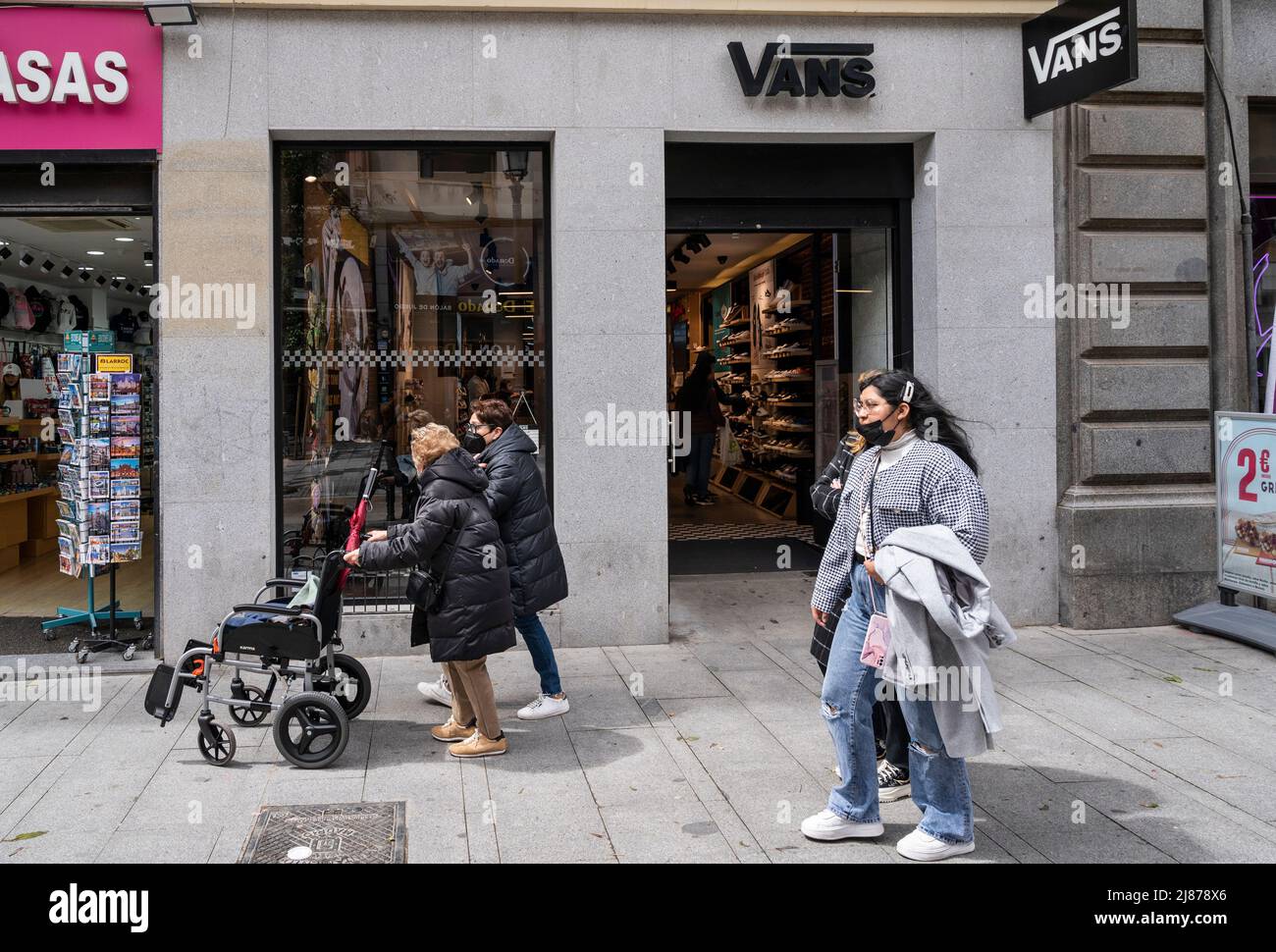 Pedestrians walk past the Multinational sports clothing brands Vans store  in Hong Kong. (Photo by Xavi Lopez / SOPA Images/Sipa USA Stock Photo -  Alamy