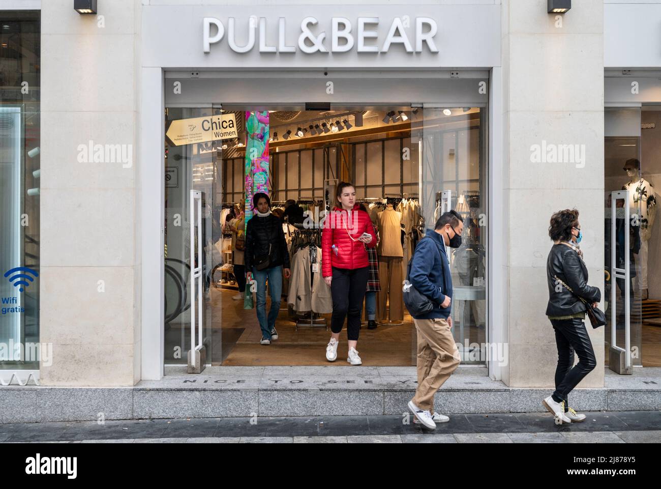Shoppers are seen at the Spanish multinational clothing design retail  company by Inditex, Pull & Bear, store and logo in Spain. (Photo by Xavi  Lopez / SOPA Images/Sipa USA Stock Photo -