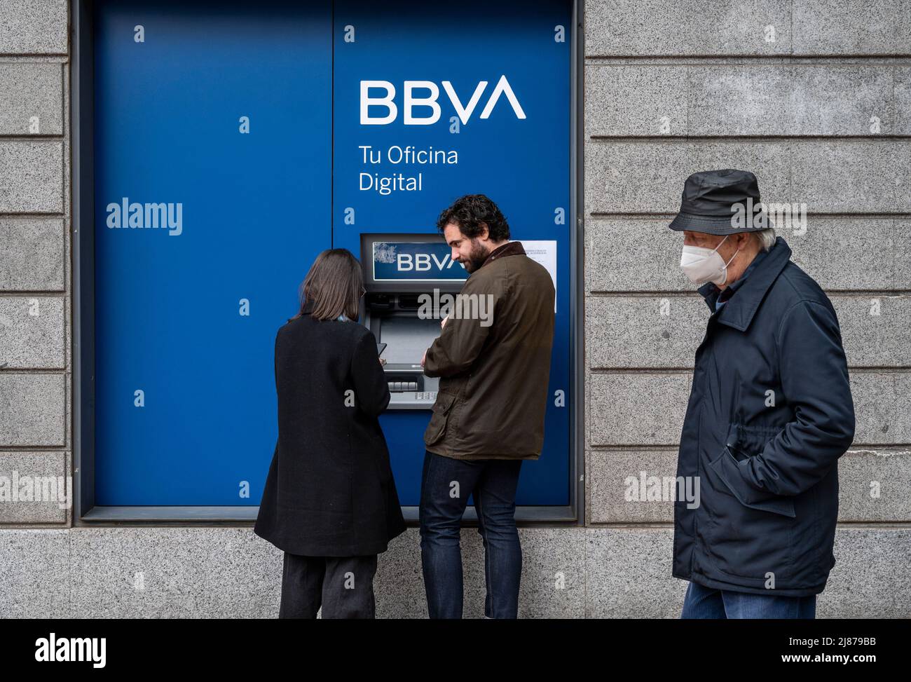 Madrid, Spain. 20th Mar, 2022. Customers are withdrawing money from an ATM machine at the Spanish multinational Banco Bilbao Vizcaya Argentaria SA (BBVA) bank in Spain. (Photo by Xavi Lopez/SOPA Images/Sipa USA) Credit: Sipa USA/Alamy Live News Stock Photo