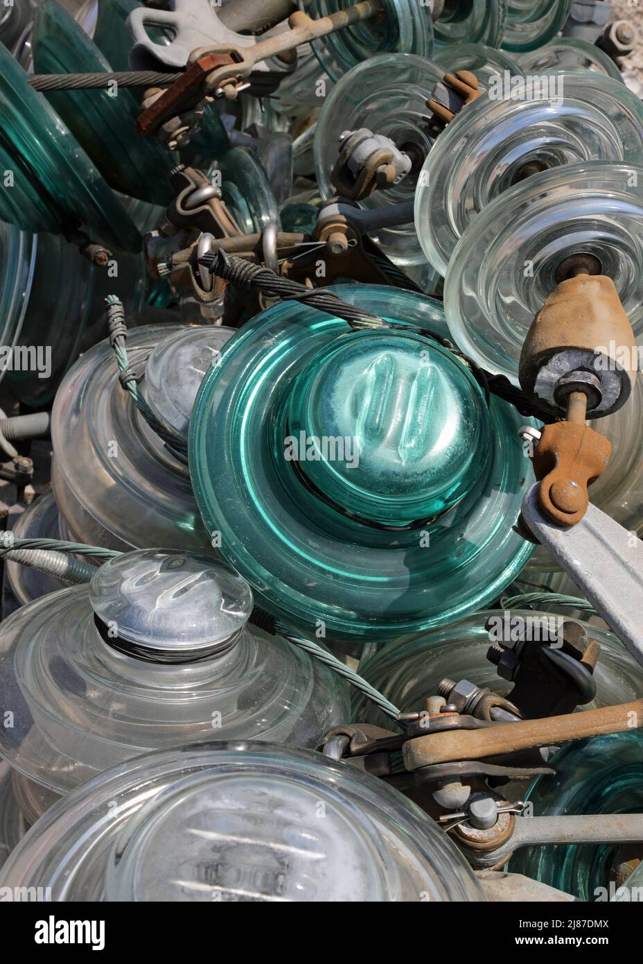 many glass insulators used in high voltage power lines to insulate