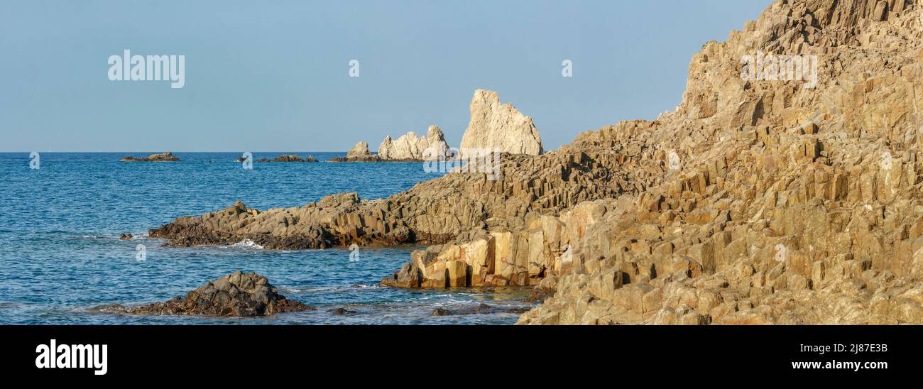 Basalt columns and Las sirenas reef, Cabo de Gata natural park, Andalusia, Spain Stock Photo