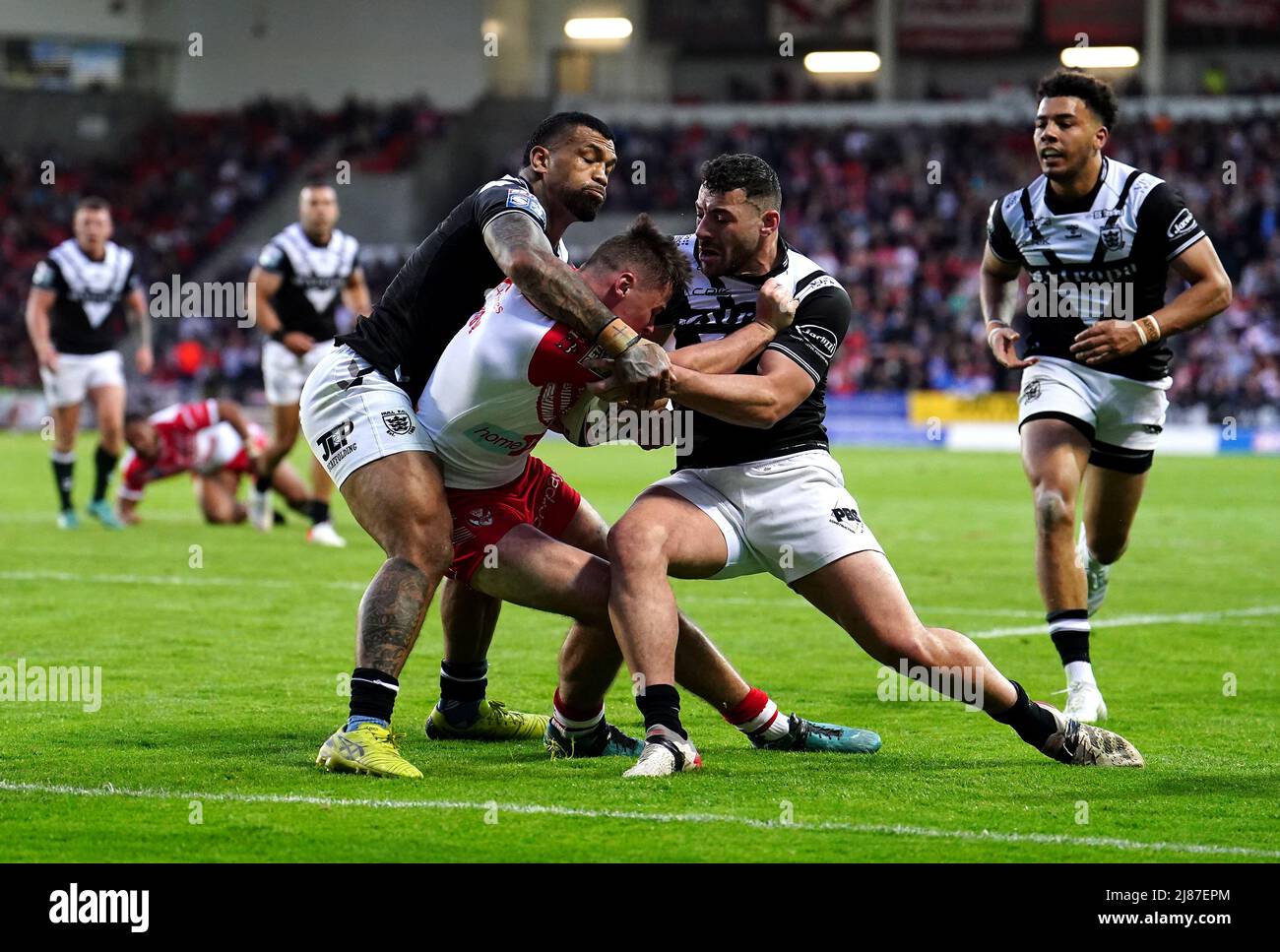 St Helens' Jack Welsby (centre) on their way to scoring their side's second try of the game during the Betfred Super League match at the Totally Wicked Stadium, St Helens. Picture date: Friday May 13, 2022. Stock Photo