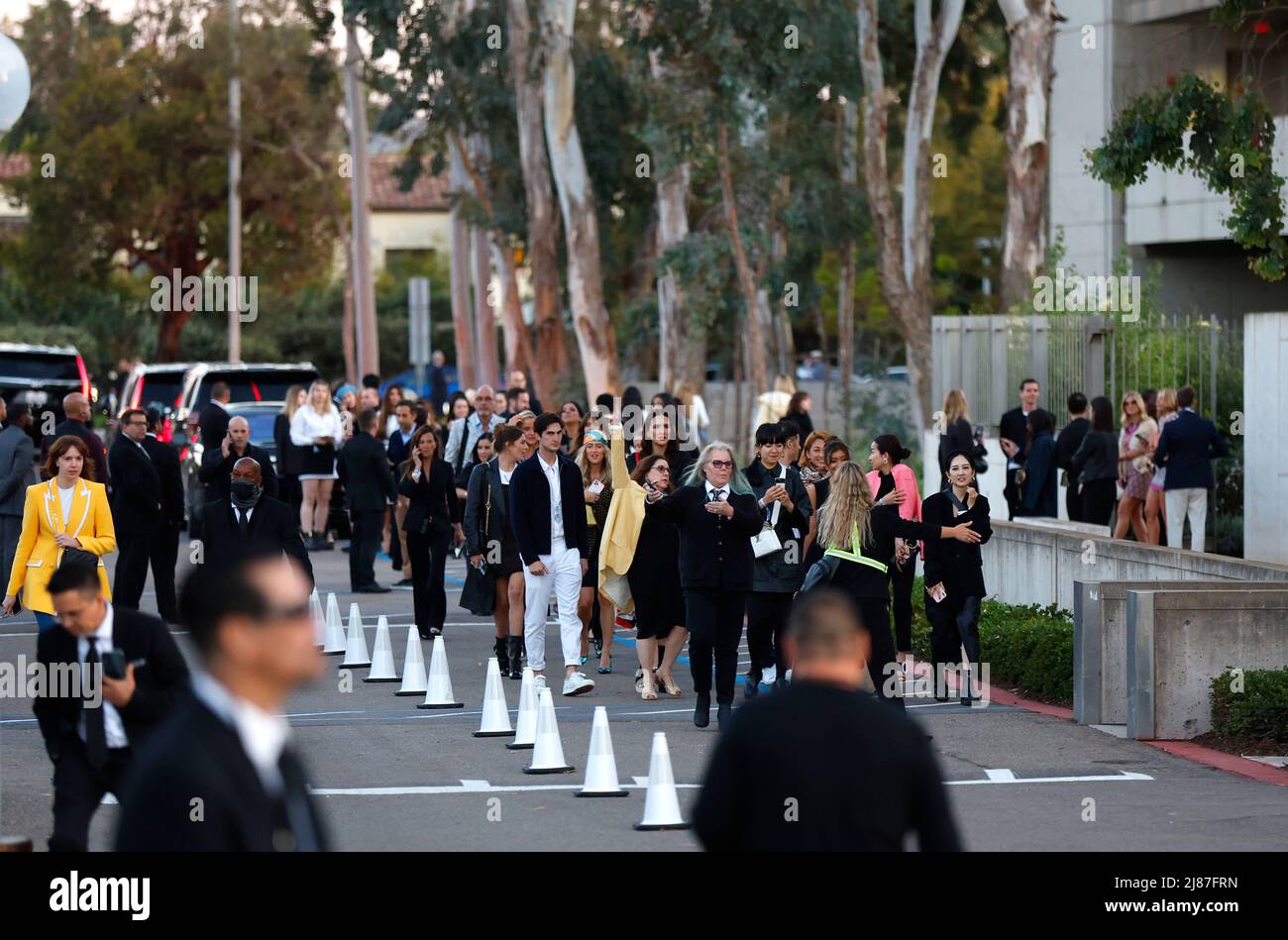 May 12, 2022, San Diego, California, USA: Spectators exit the Louis Vuitton's 2023 Cruise Show at the Salk Institute for Biological Studies. (Credit Image: © K.C. Alfred/ZUMA Press Wire) Stock Photo