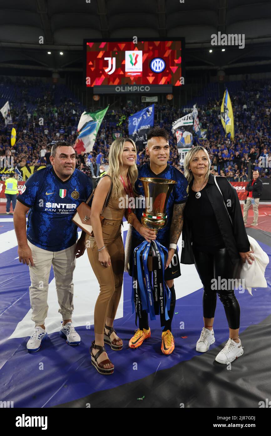 Rome, Italy, 11th May 2022. Lautaro Martinez of FC Internazionale poses with his father Mario Martinez, his fiancee Agustina Gandolfo and his mother Karina Vanesa Gutierrez with the trophy following the 4-2 victory in the Coppa Italia match at Stadio Olimpico, Rome. Picture credit should read: Jonathan Moscrop / Sportimage Stock Photo