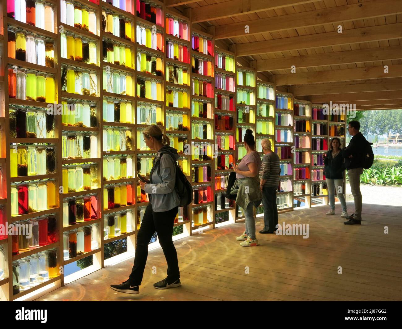 Visitors walk through the Almeerse Wolunie pavilion where a wall of