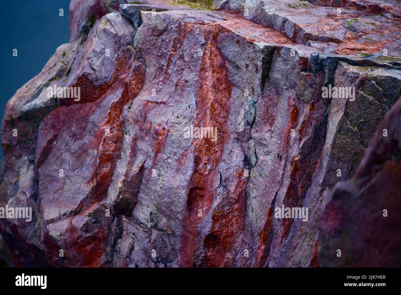 different red shapes in a rock Stock Photo - Alamy