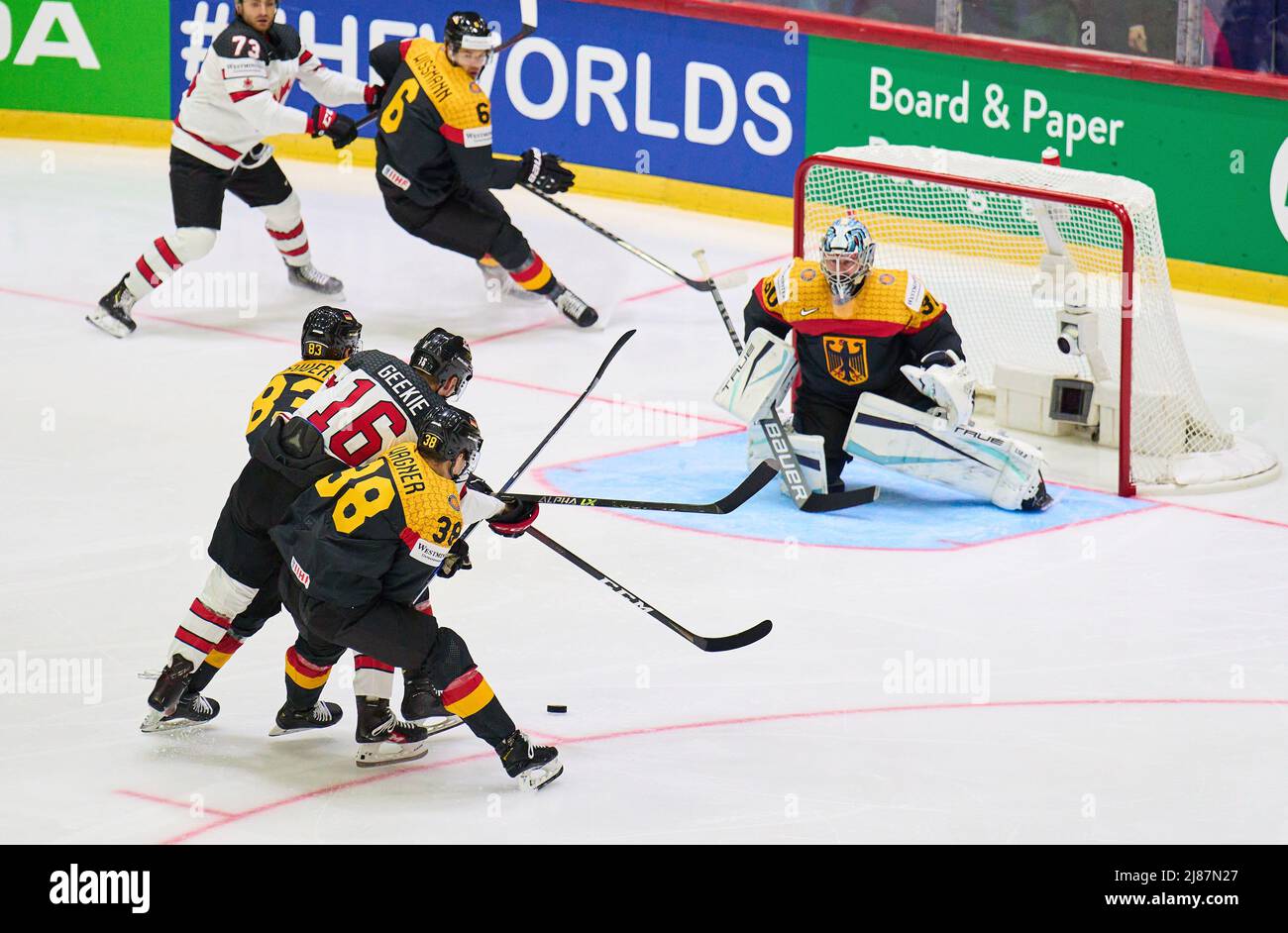 Helsinki, Finland. 13th May, 2022. Fabio Wagner Nr.38 of Germany NHL goalie Philipp GRUBAUER Goalie  Nr.30 of Germany compete, fight for the puck against, Morgan Geekie Nr. 16 of Canada   in the match GERMANY - CANADA  IIHF ICE HOCKEY WORLD CHAMPIONSHIP Group B  in Helsinki, Finland, May 13, 2022,  Season 2021/2022 © Peter Schatz / Alamy Live News Credit: Peter Schatz/Alamy Live News Stock Photo