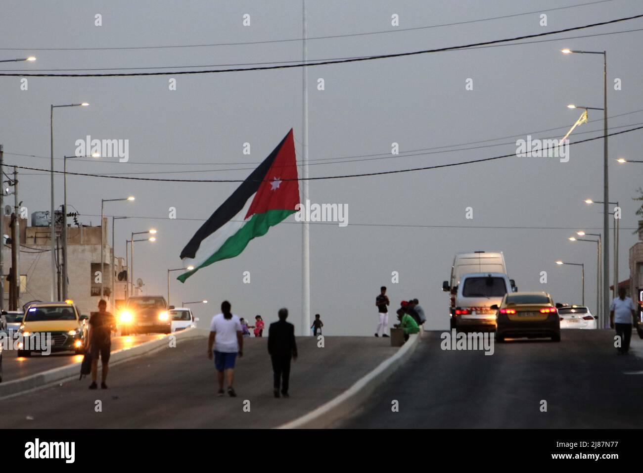 Amman, Jordan. 13th May, 2022. Jordanian national flag is seen at half