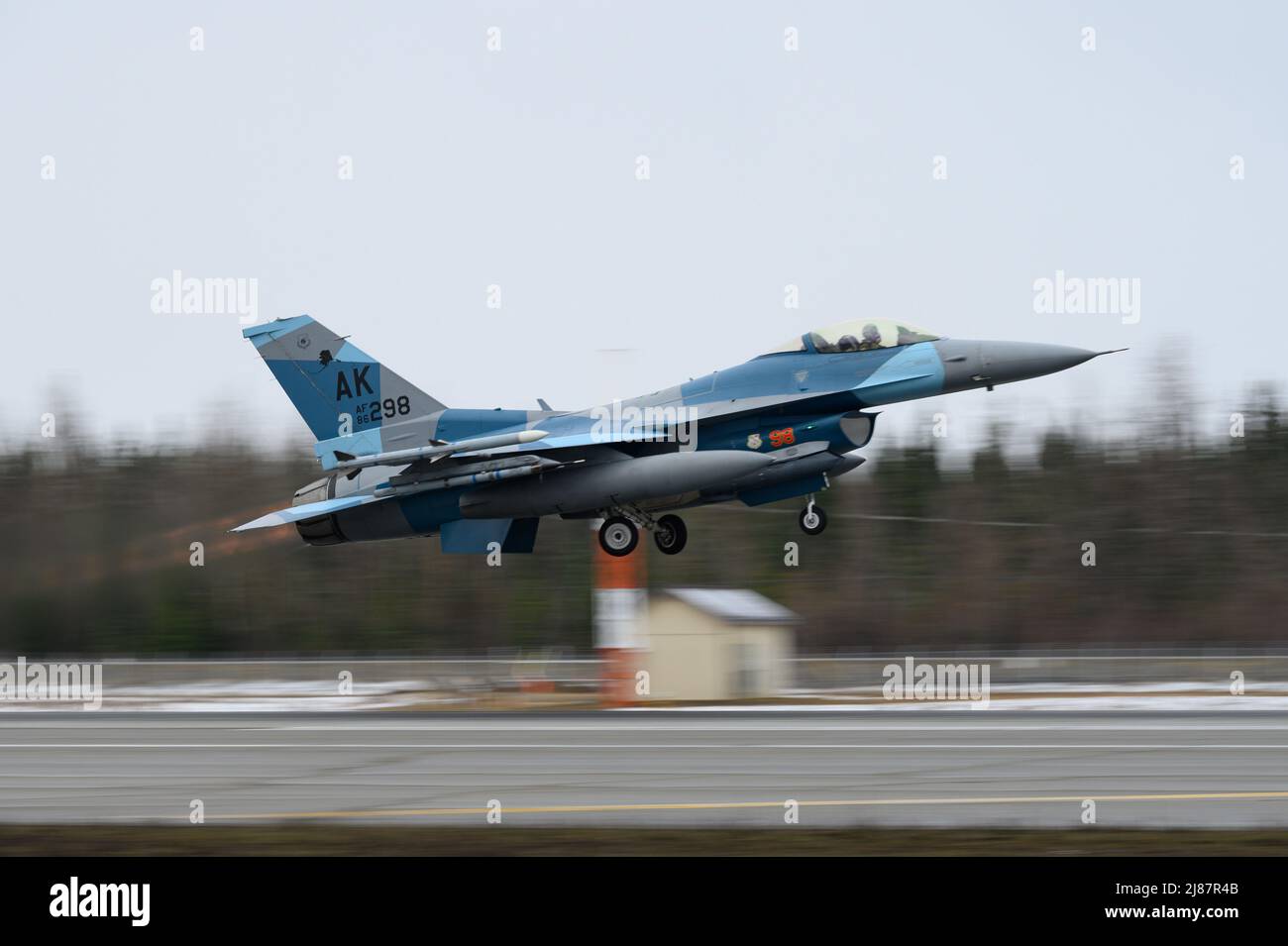 A U.S. Air Force F-16 Fighting Falcon assigned to the 18th Aggressor Squadron takes off from Eielson Air Force Base, Alaska, during RED FLAG-Alaska 22-1, May 9, 2022. The 18th AGRS supports RF-A 22-1 by sharing its knowledge of adversarial tactics, techniques and procedures to participating units, ensuring the United States and its allies receive the best air combat training possible. (U.S. Air Force photo by Senior Airman Jose Miguel T. Tamondong) Stock Photo