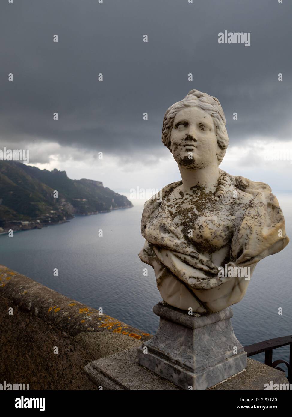 White marble bust and drak clouds ,over Amalfi Coast, seen from Terrazza dell'lnfinito, Villa Cimbrone Stock Photo