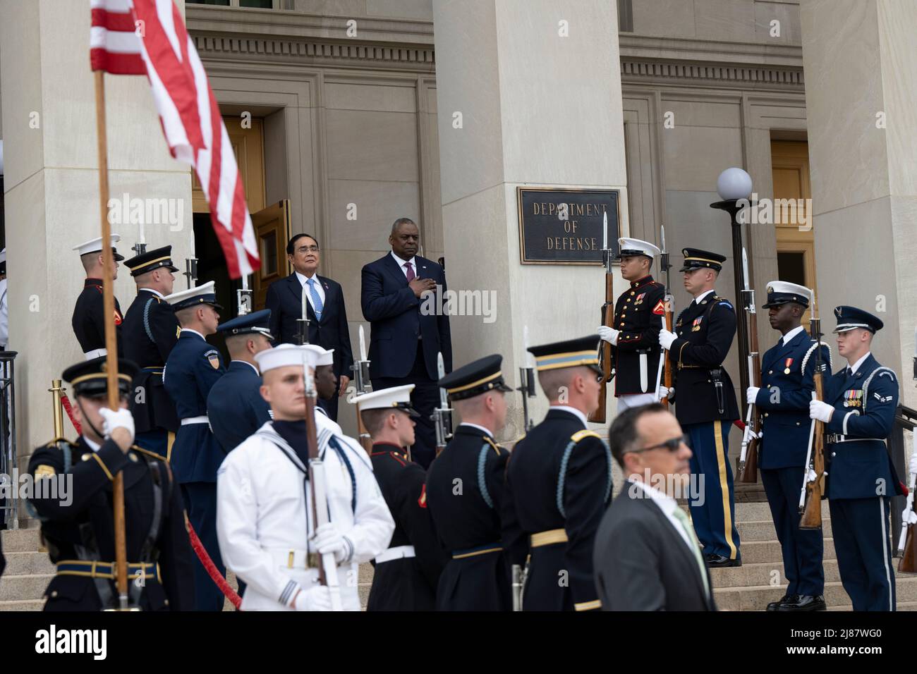 Arlington, United States Of America. 12th May, 2022. Arlington, United States of America. 12 May, 2022. U.S. Secretary of Defense Lloyd J. Austin III, stands for the national anthems alongside Thai Prime Minister Prayut Chan-o-cha, left, during the arrival ceremony at the Pentagon, May 12, 2022 in Arlington, Virginia. Credit: Lisa Ferdinando/DOD/Alamy Live News Stock Photo