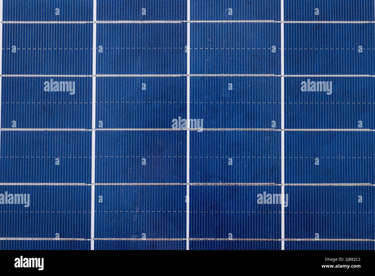 Overhead full frame shot of white grid patterns on blue solar panel Stock Photo