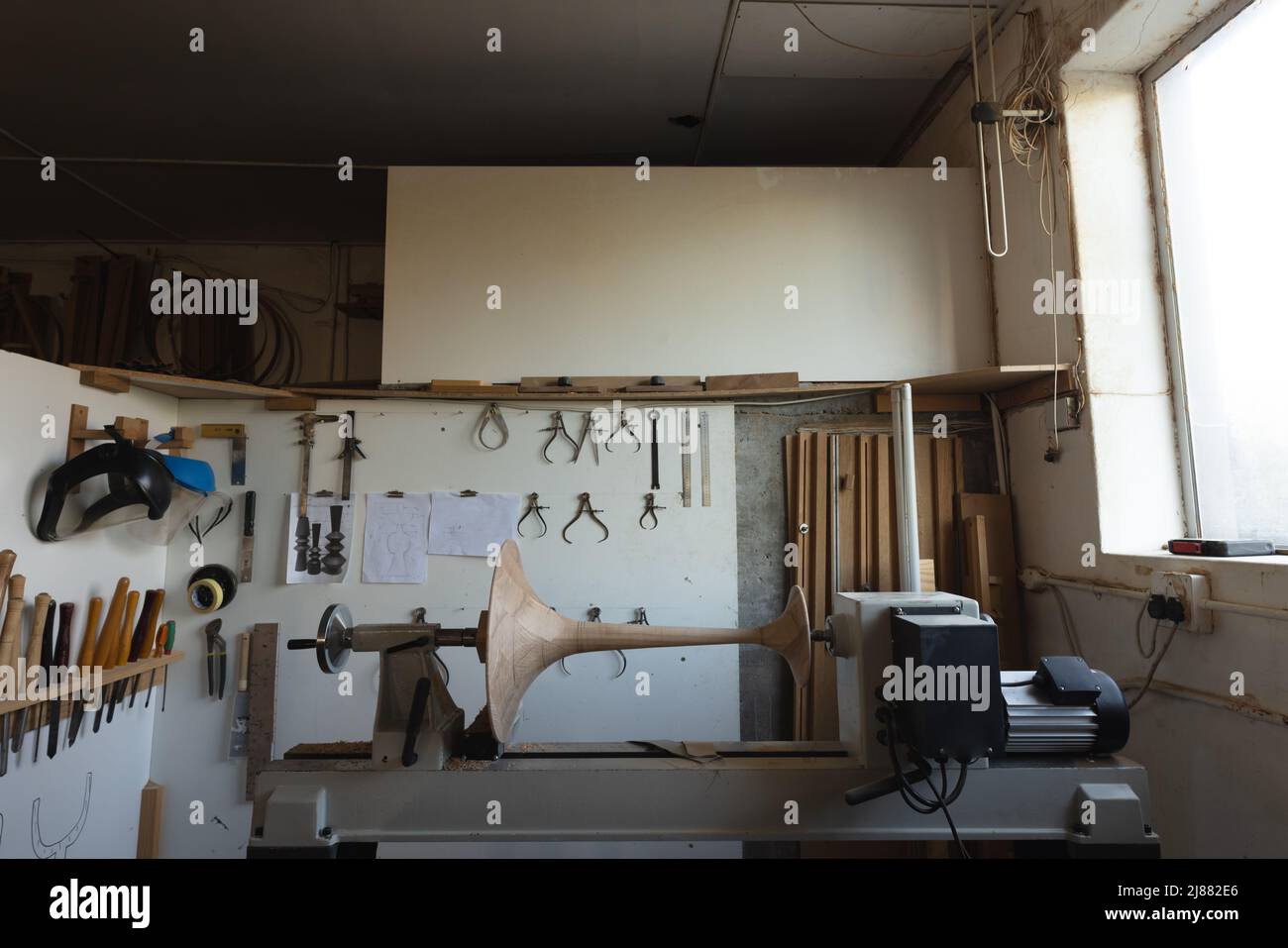 Various woodworking tools and manufacturing equipment in workshop, copy space Stock Photo