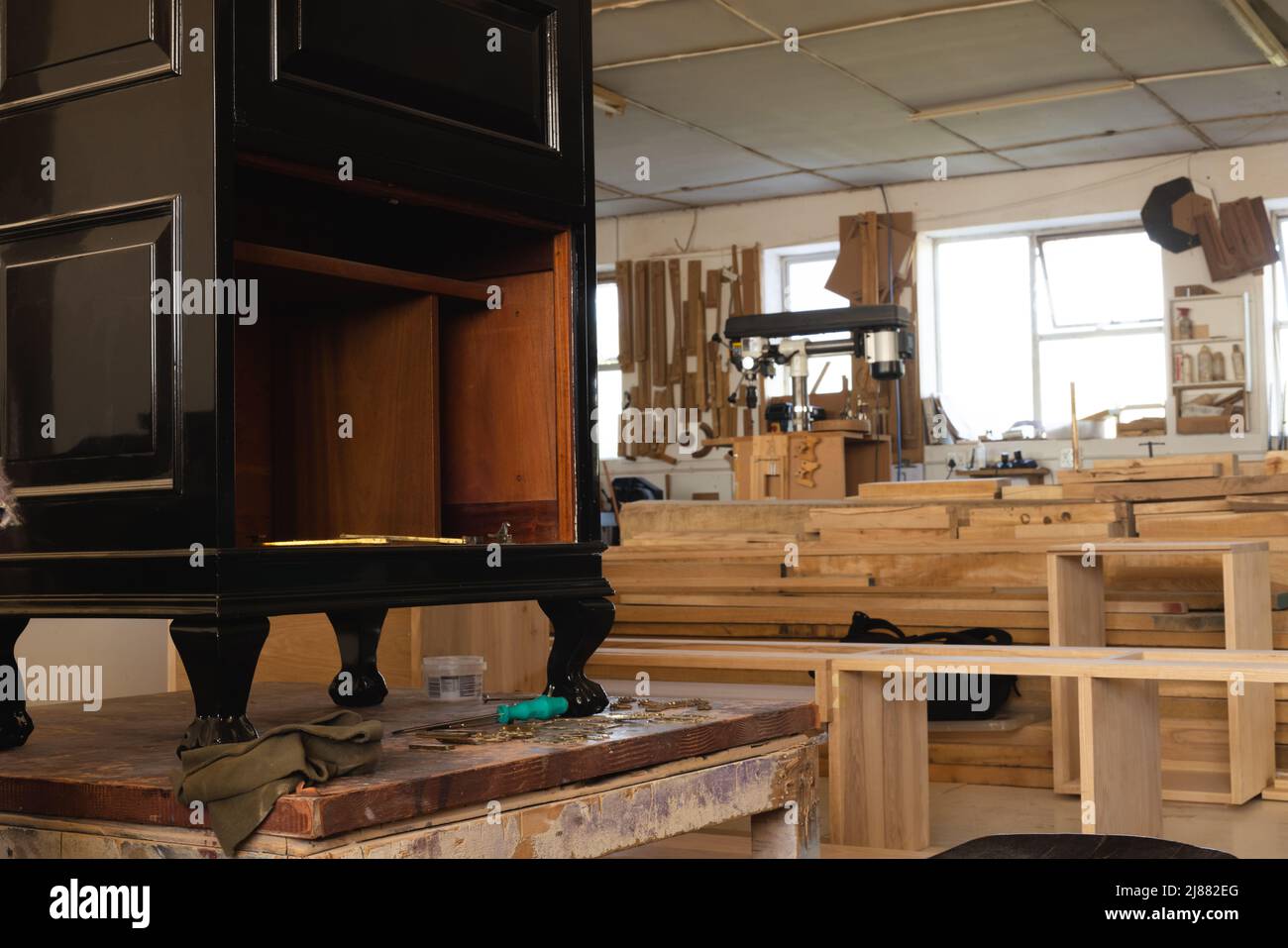 Interior of workshop with incomplete wooden cabinet Stock Photo