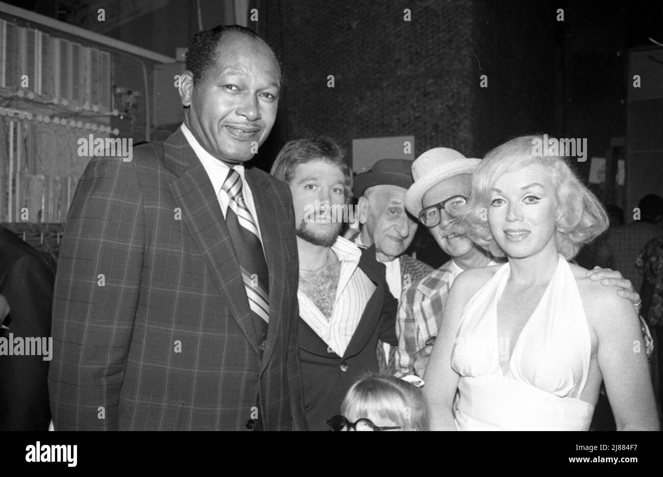 LA Mayor Tom Bradley with agent Ron Smith and his celebrity lookalikes at the Bistro Restaurant in Beverly Hill, California 1977 Credit: Ralph Dominguez/MediaPunch Stock Photo