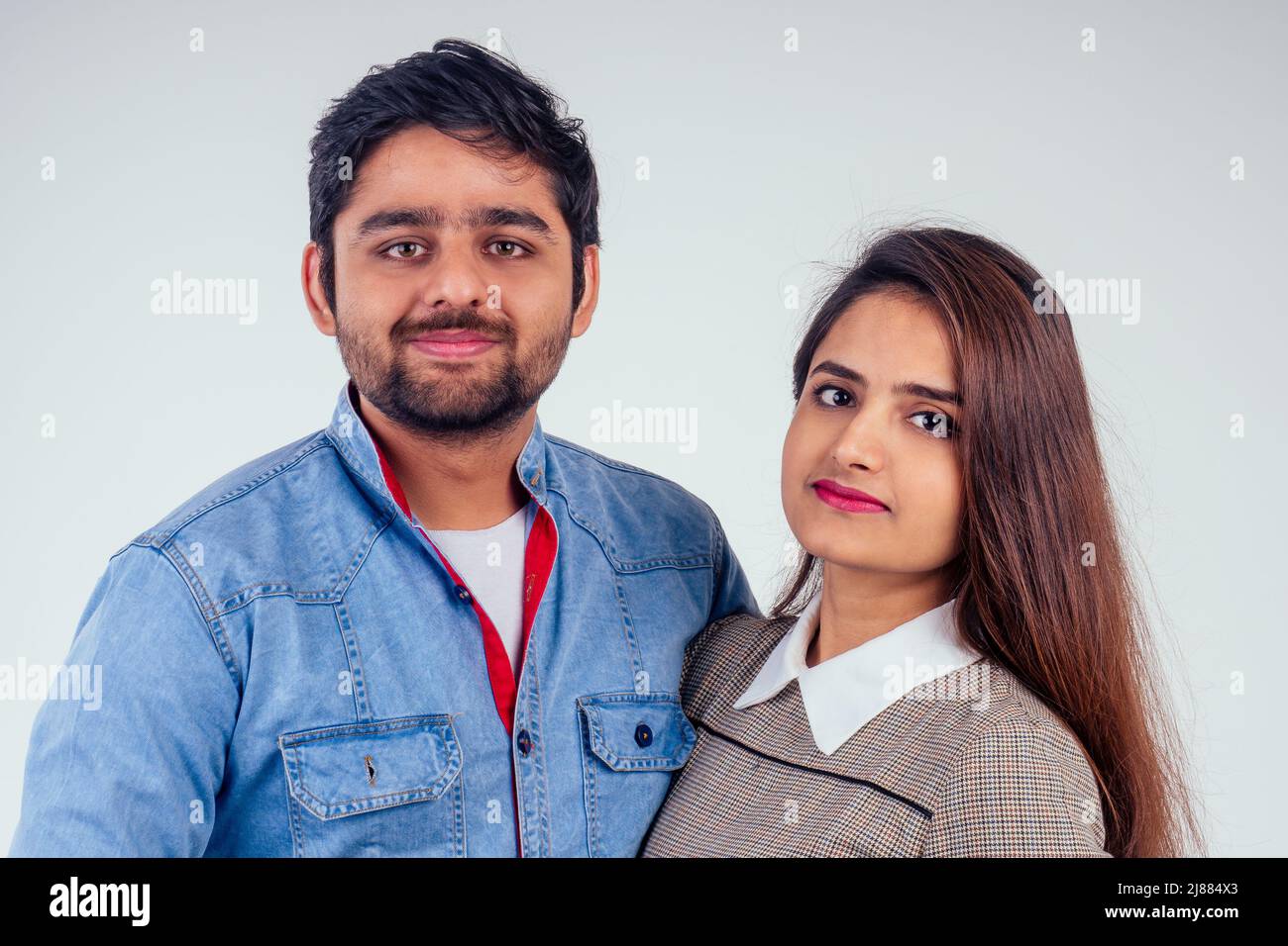 indian couple in love posing at studio white background 2J884X3