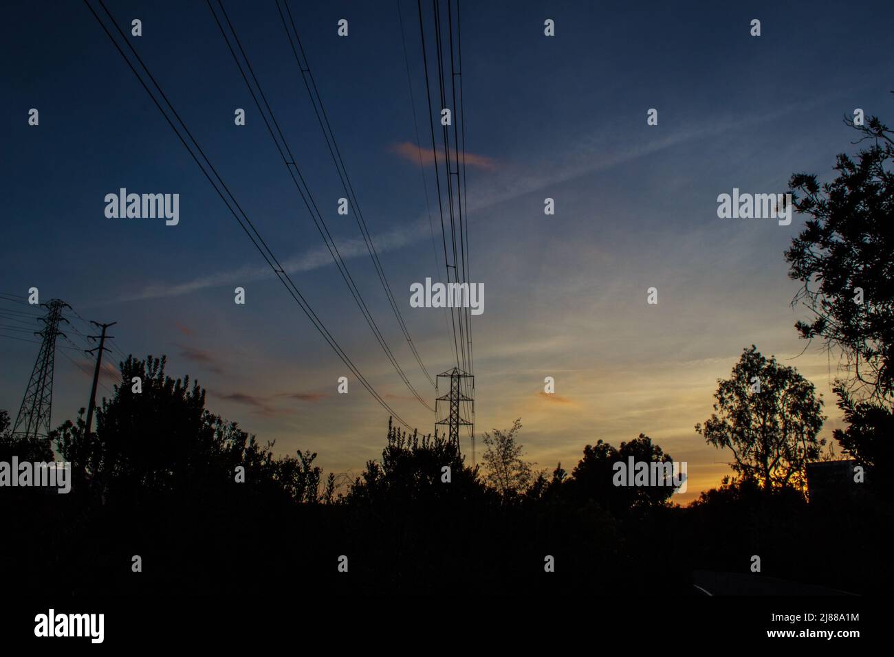 Power Line Silhouette During Sunset Stock Photo - Alamy