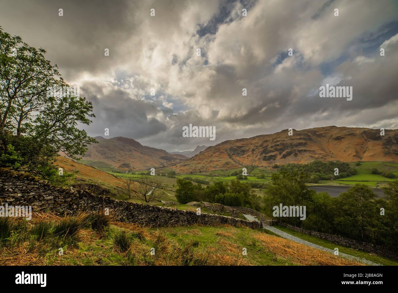 Little Langdale, English Lake District, Cumbria. UK. 13th May 2022. UK Weather. View towards the Langdale Pikes from the Little Langdale Valley. Credit:greenburn/Alamy Live News. Stock Photo