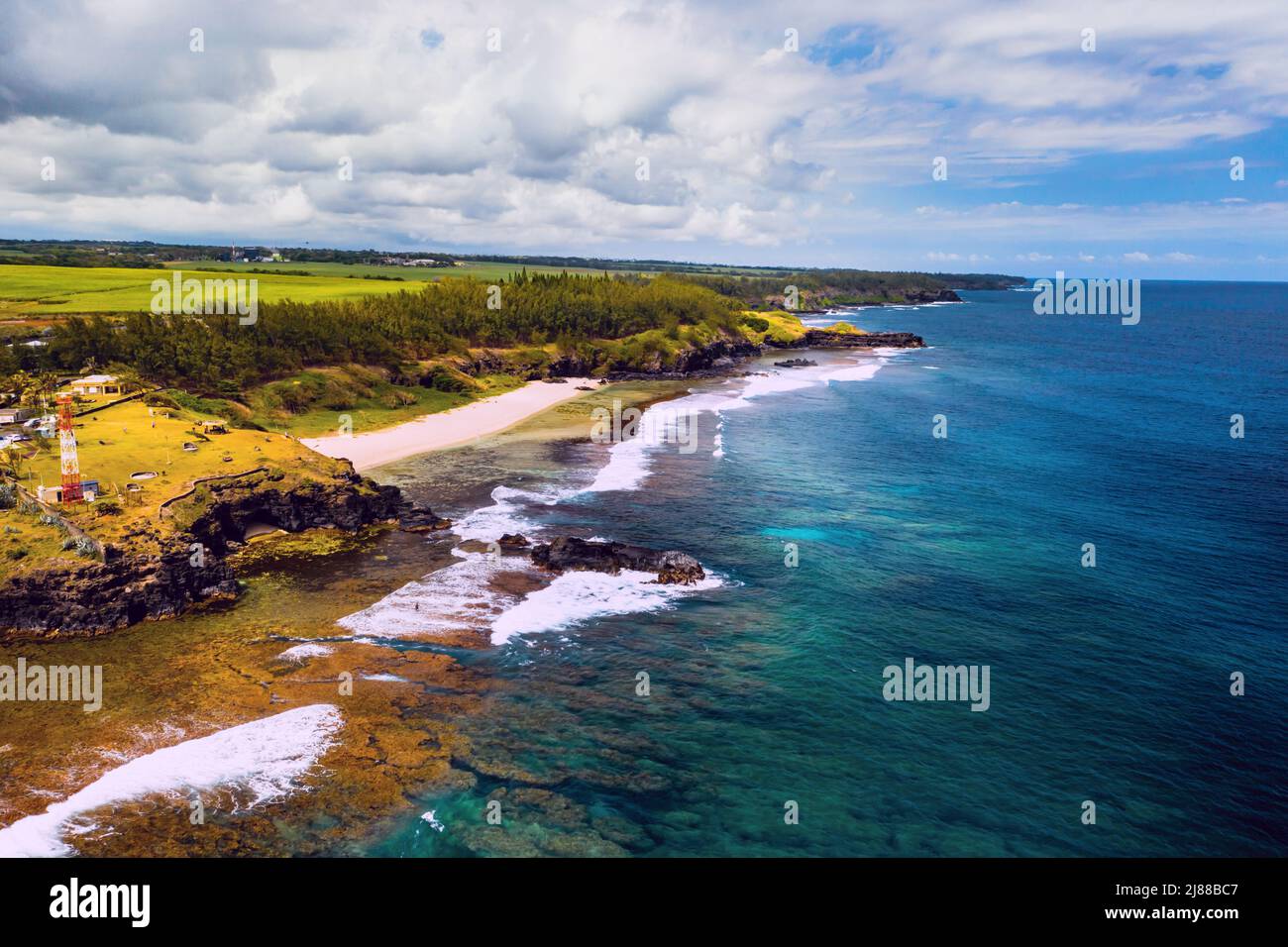 Aerial view of the cliffs of the spectacular Gris Gris Beach, in southern Mauritius. Here, is the strong waves of the Indian Ocean crashing towards th Stock Photo