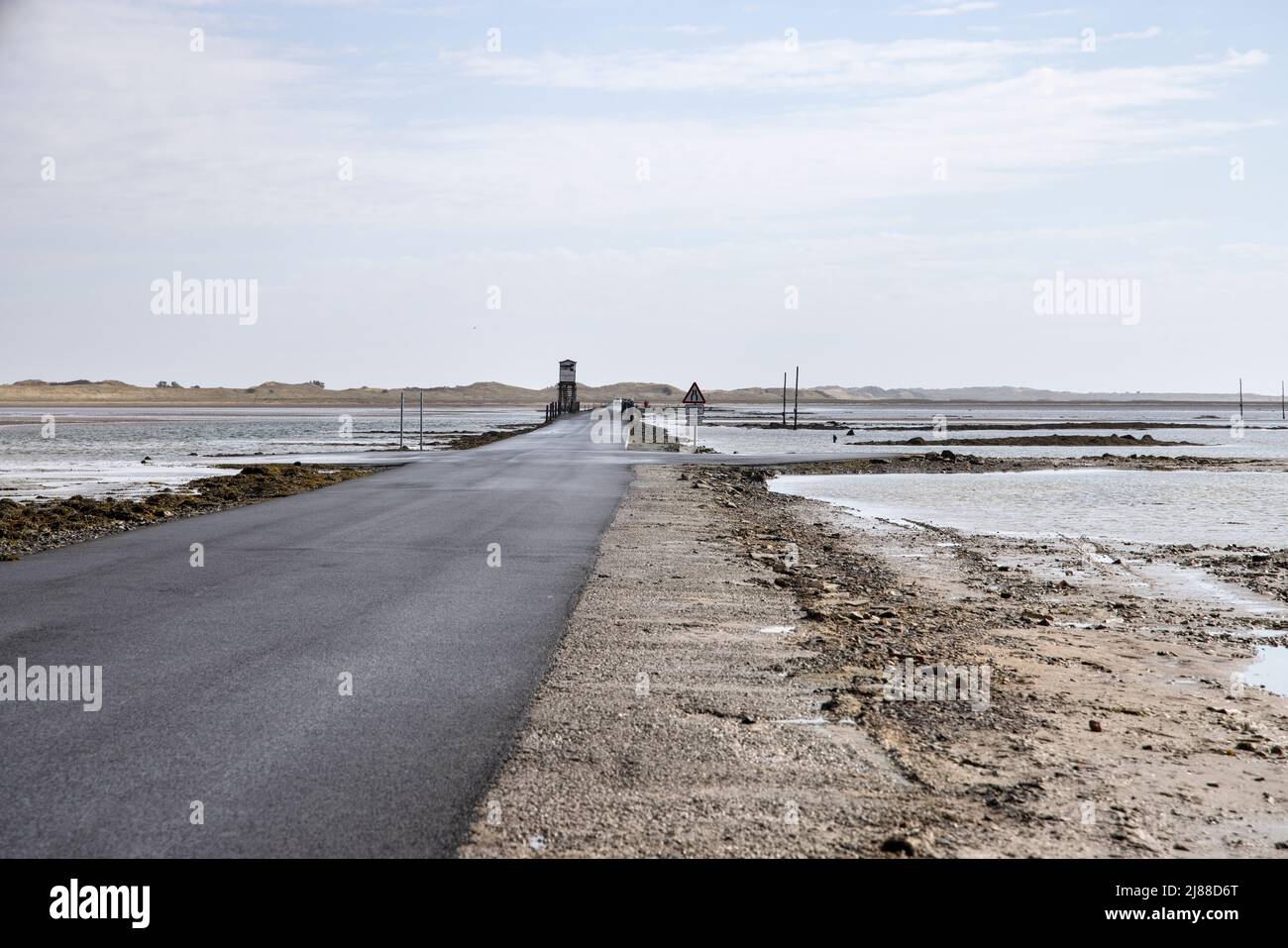 the causeway can only be crossed close to low tide at holy island lindisfarne northumberland Stock Photo