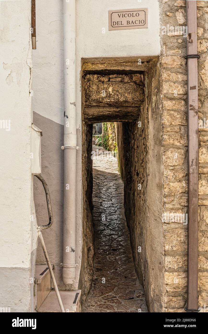 Vicolo del Bacio is the most romantic alley in Italy. Very narrow and legendary, it is the most photographed alley in the village of Vico del Gargano. Stock Photo
