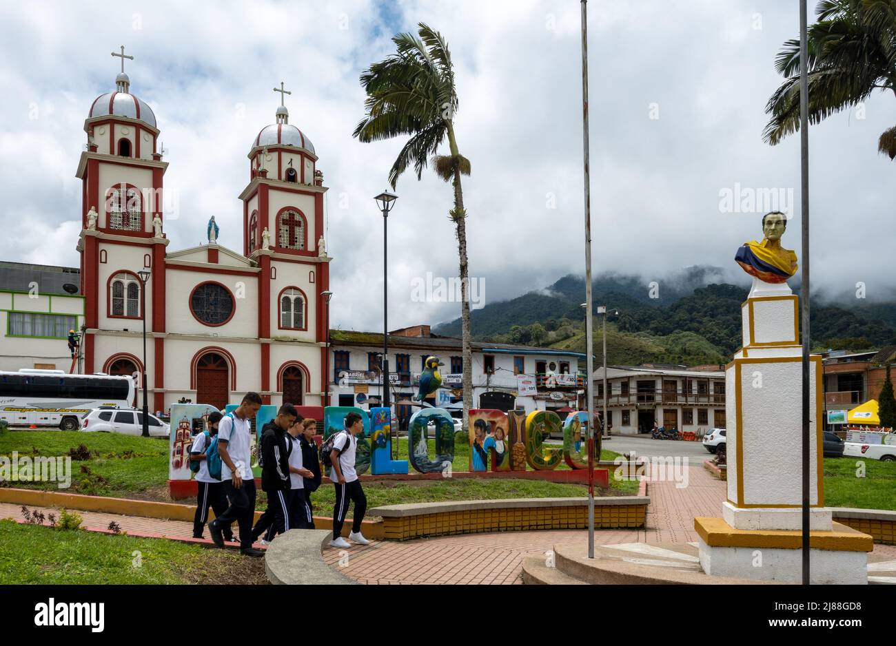 A group of students walk across town square. Pueblo Rico, Colombia ...