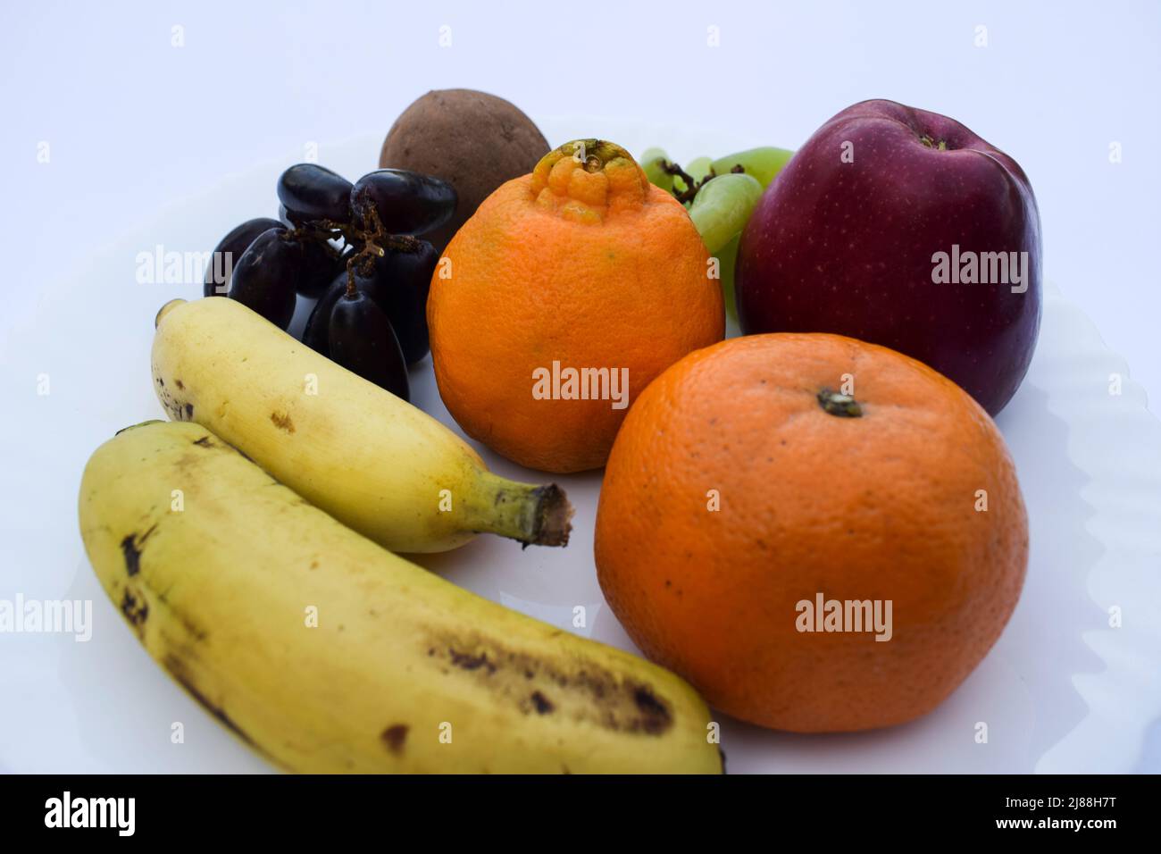 Mix of many fruits like Apple, Oranges, malta, two types of bananas