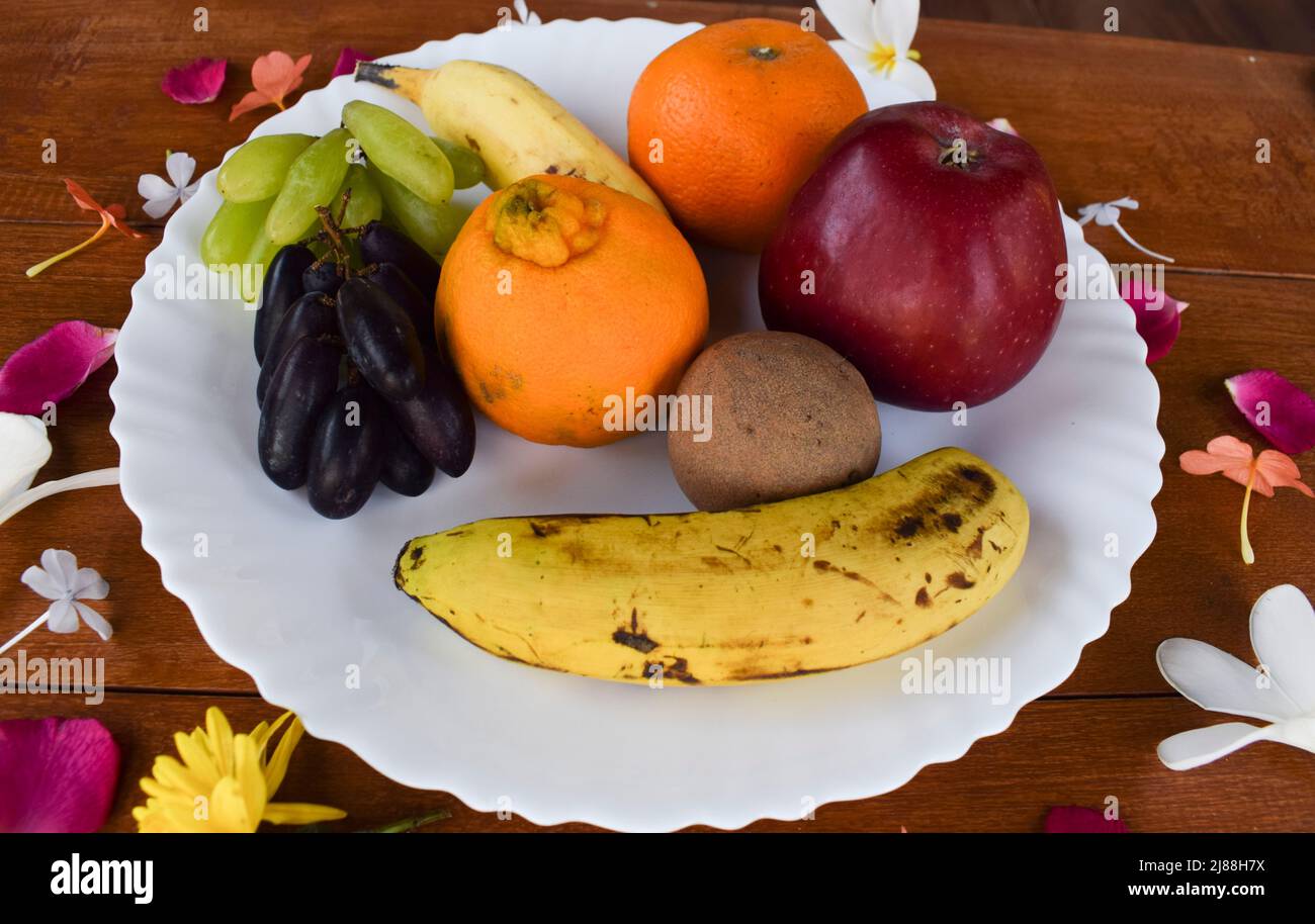 Mix of many fruits like Apple, Oranges, malta, two types of bananas