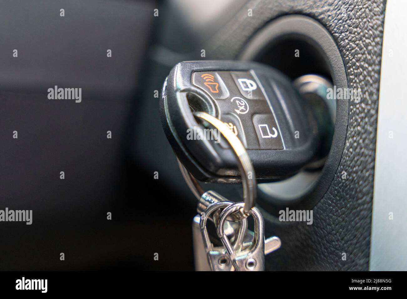 the car ignition key inserted into the car lock Stock Photo Alamy