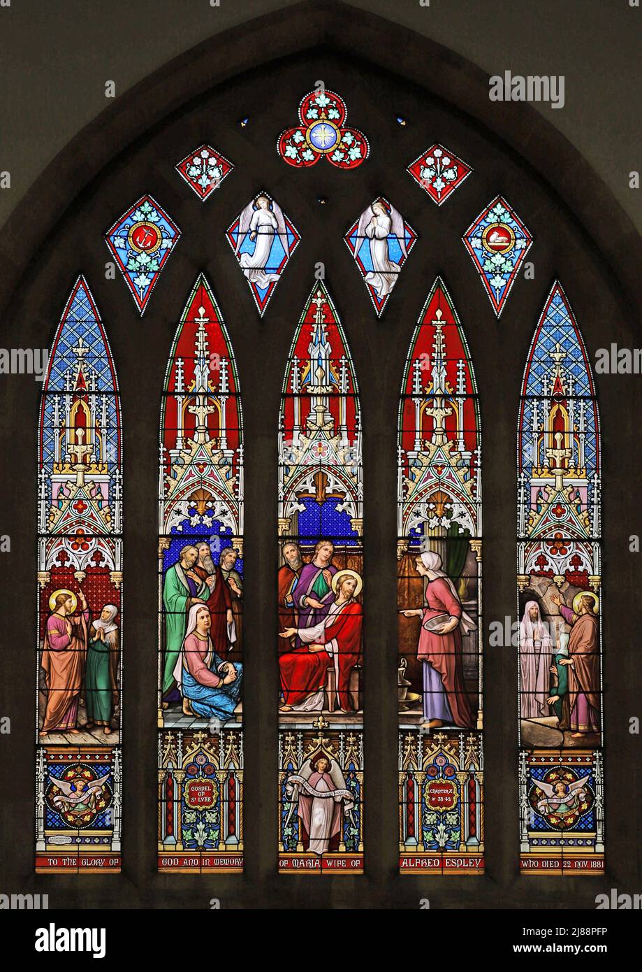 A stained glass window depicting Jesus in the house of Martha and Mary ...