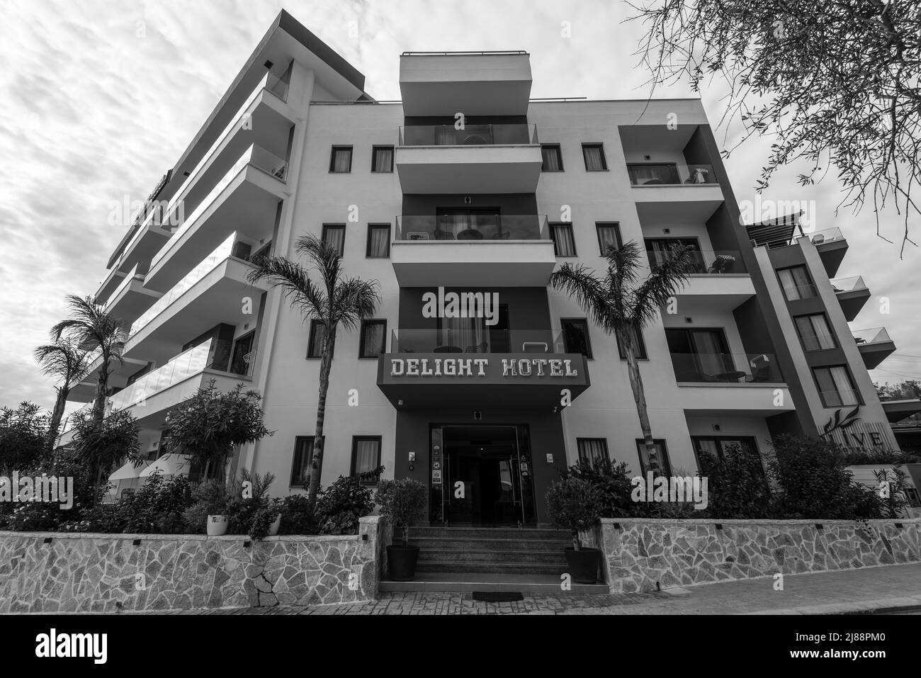 Ksamil, Albania - September 9, 2021: View of the Delight Hotel in Ksamil, Albania. Black and white photography. Stock Photo