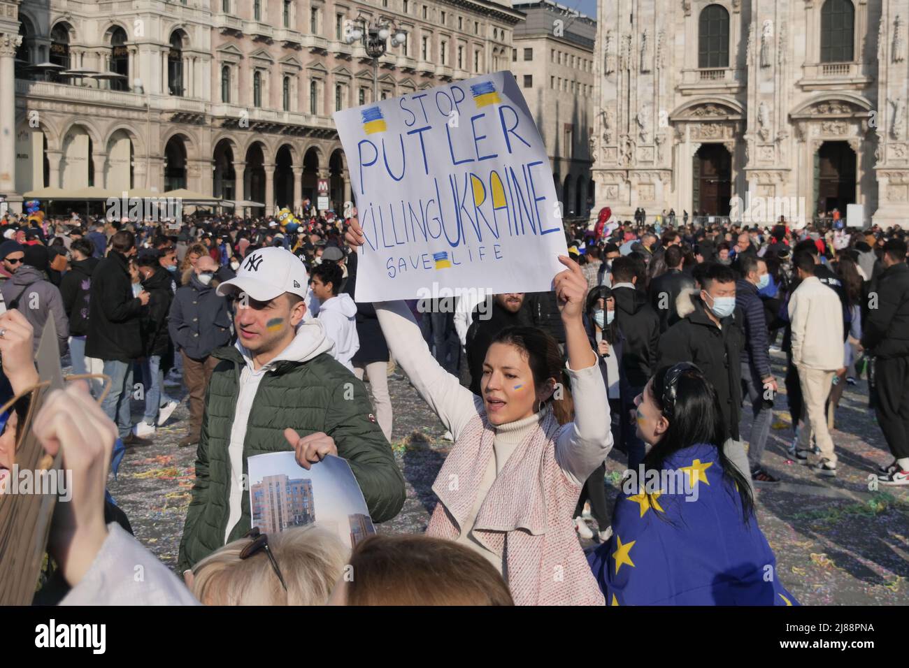 Protest of Ukrainians peoples in Duomo square Milan against the war and against the Russian leader Putin Stock Photo