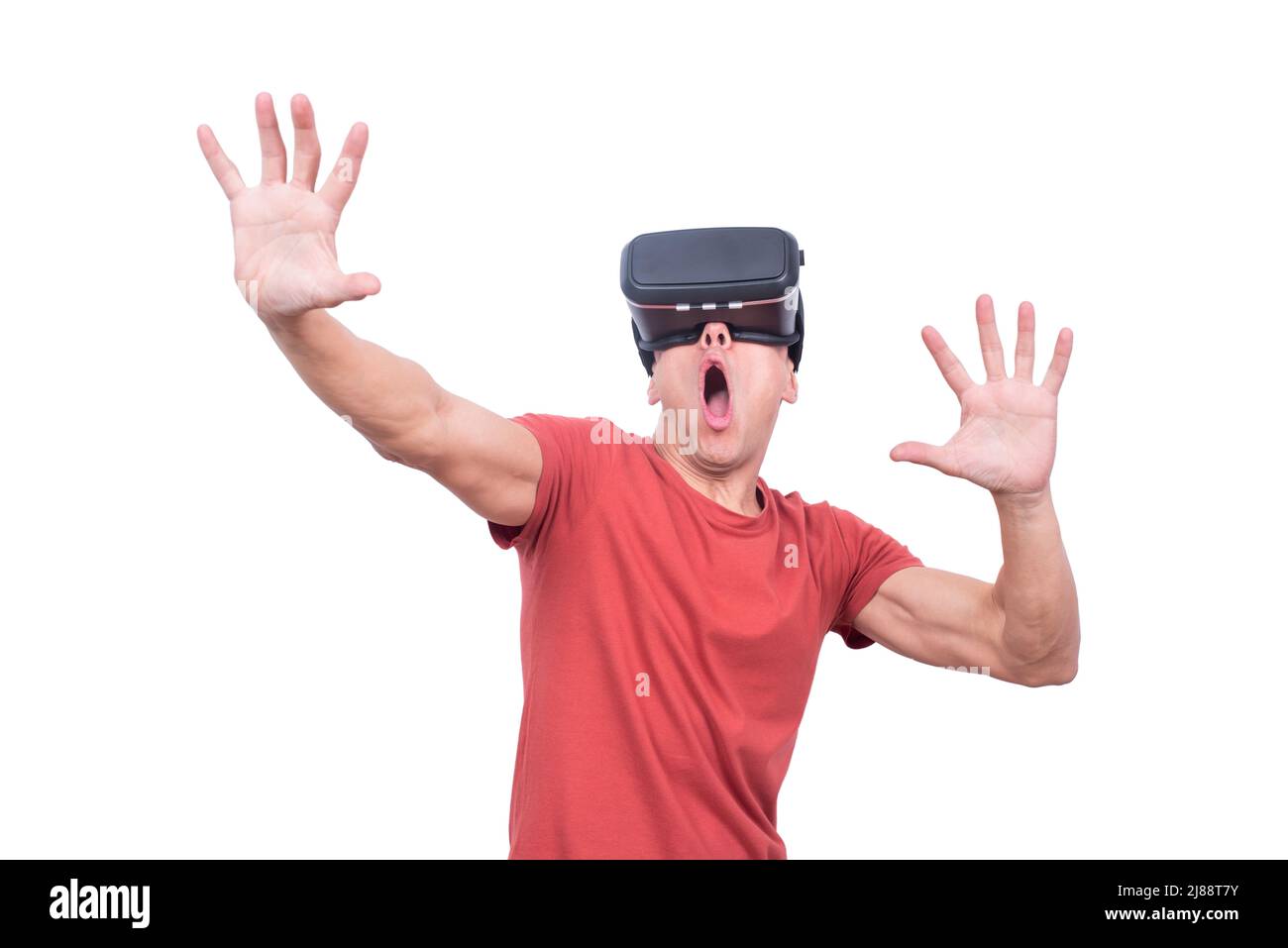 Astonished man exploring virtual reality in goggles Stock Photo