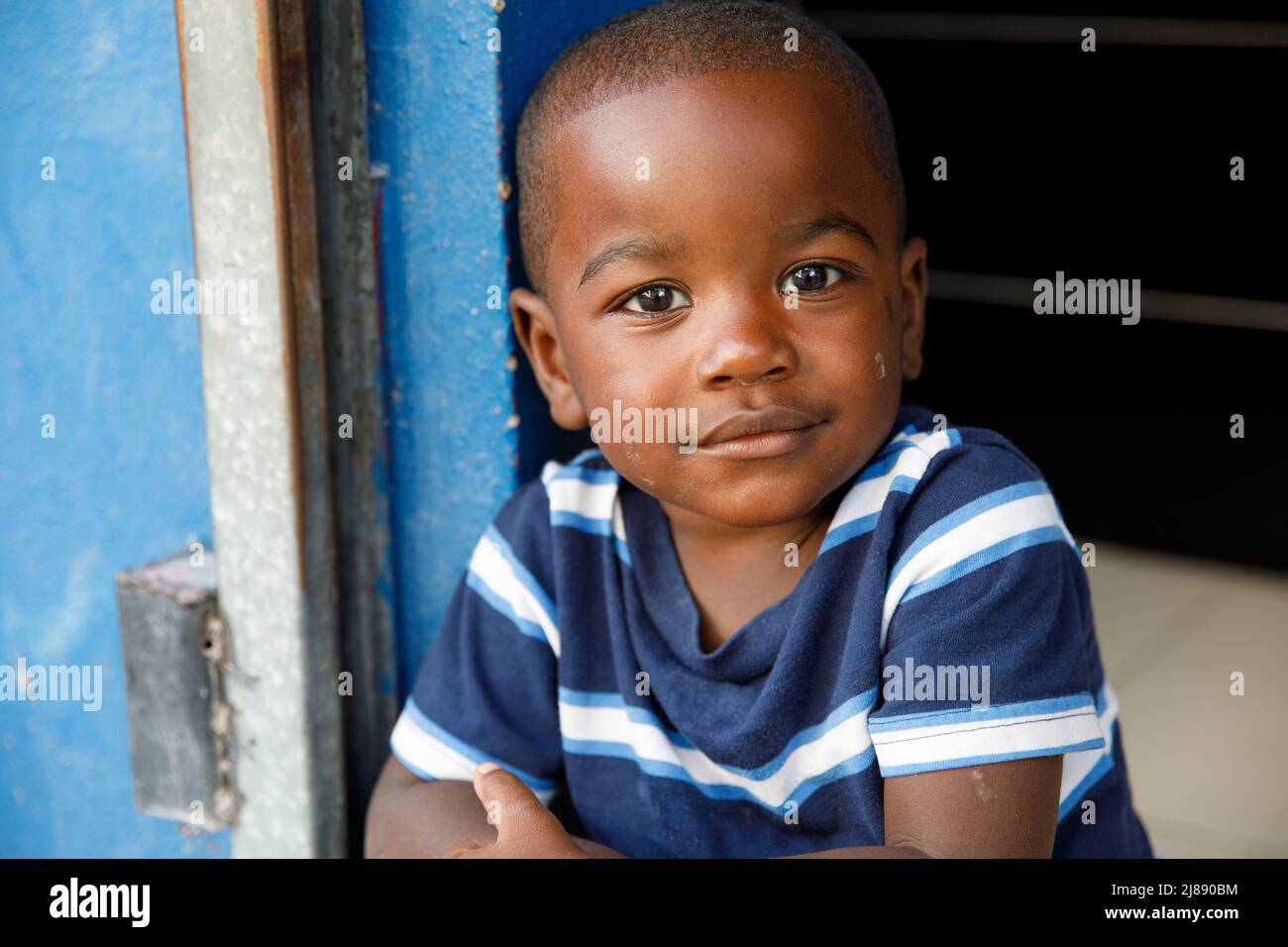 2022.03.14 Dominican Republic Punta Cana Bavaro. Portrait of a child. A little African-American boy looks into the camera and smiles. Dominican people Stock Photo