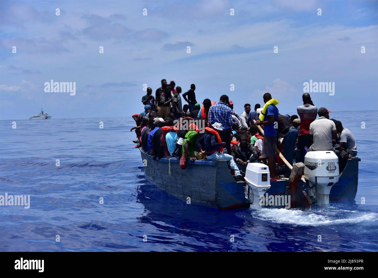 Caribbean Sea, Turks and Caicos. 09 May, 2022. A Coast Guard Cutter Campbell law enforcement crew stops a grossly overloaded, unsafe vessel carrying Haitian migrants attempting to flee the ongoing political instability of Haiti, May 9, 2022 near Turks and Caicos. Stock Photo
