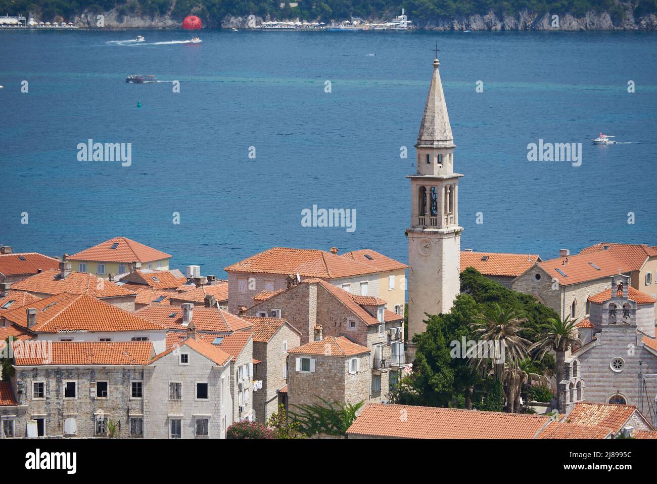 Old town with tower in Budva against sea Stock Photo