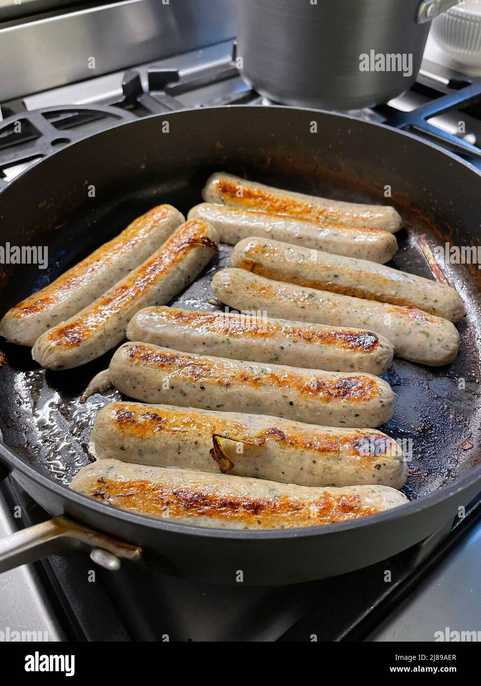 Bangers Cooking on a Home Stovetop, USA, 2022 Stock Photo