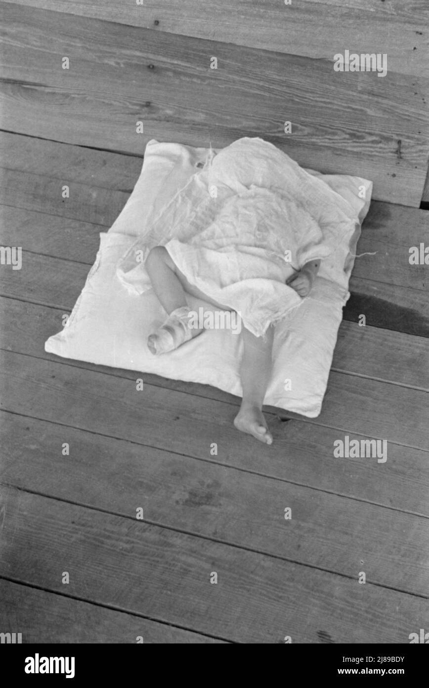 Squeakie asleep (Othel Lee Burroughs). Child of a Hale County, Alabama cotton sharecropper. Stock Photo