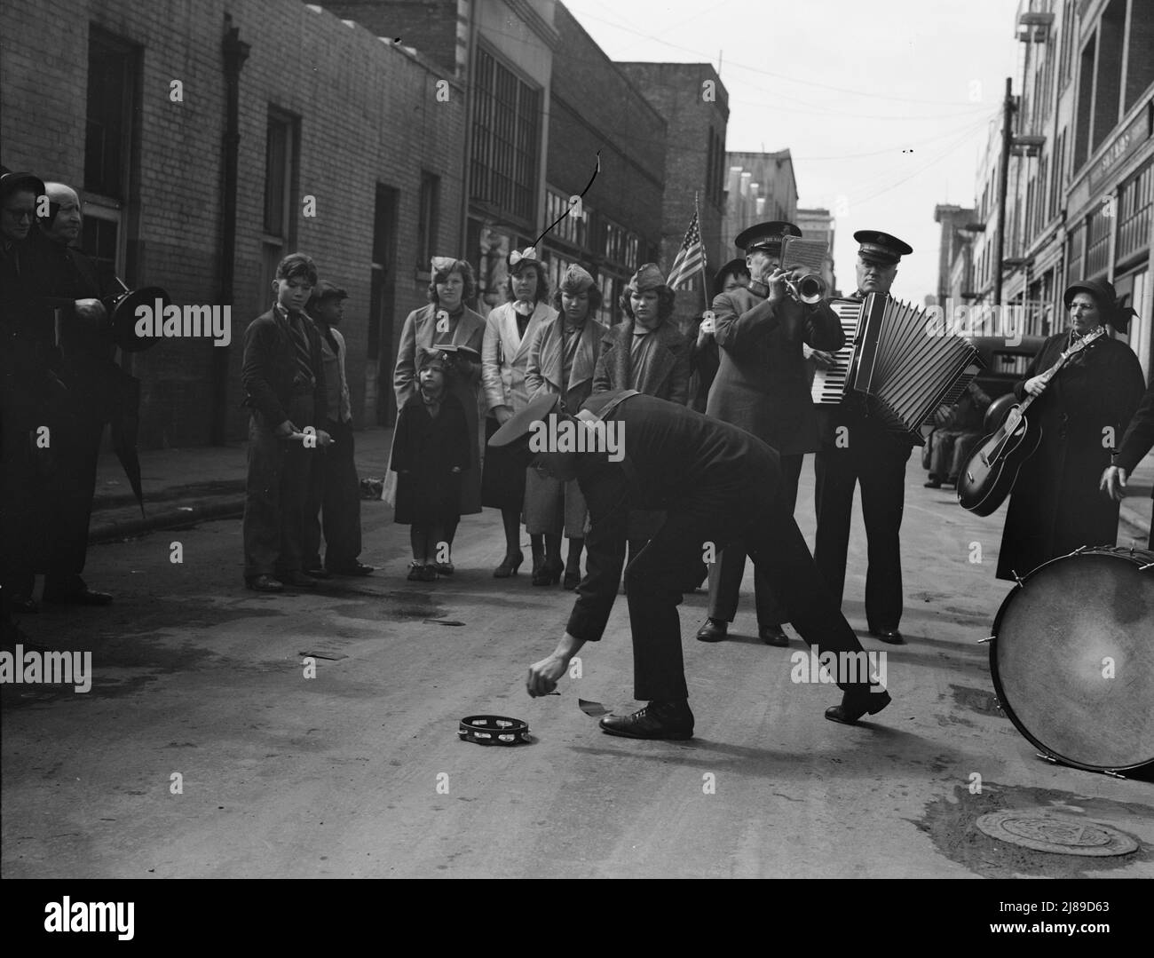 Salvation Army, San Francisco, California. Army contributes first to the tambourine (two dollars), outside contribution about seventy-five cents, all from drunks and the like. Stock Photo