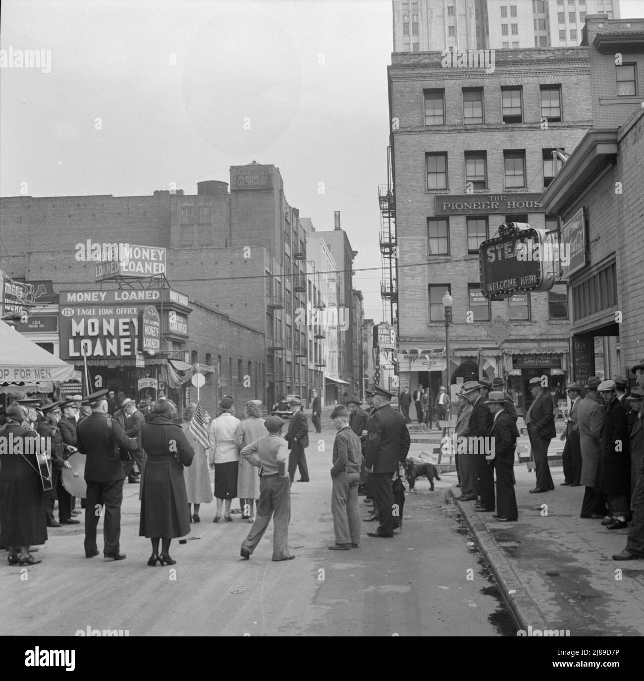 Salvation Army, San Francisco, California. General view of army and crowds. [Signs: 'Money Loaned; Eagle Loan Office; The Pioneer House; Steam Welcome Here']. Stock Photo