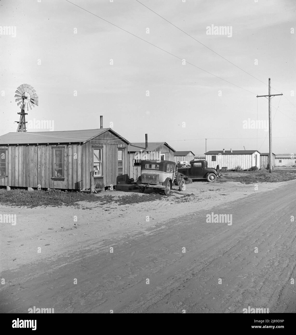 Rented cabins, ten dollars a month, in vicinity of Arkansawyers auto camp. Greenfield, Salinas Valley, California. [Very basic accommodation for farm workers from the state of Arkansas]. Stock Photo