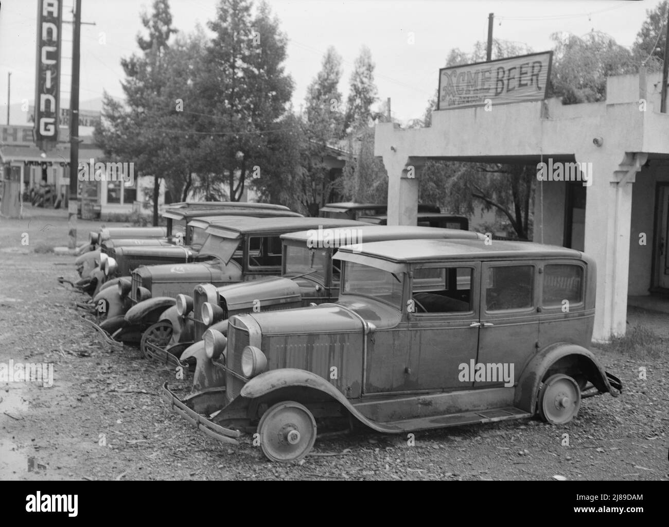Roadside used car display on State Highway 17, in season when migrants come into region for pea-picking. Santa Clara County, California. Stock Photo