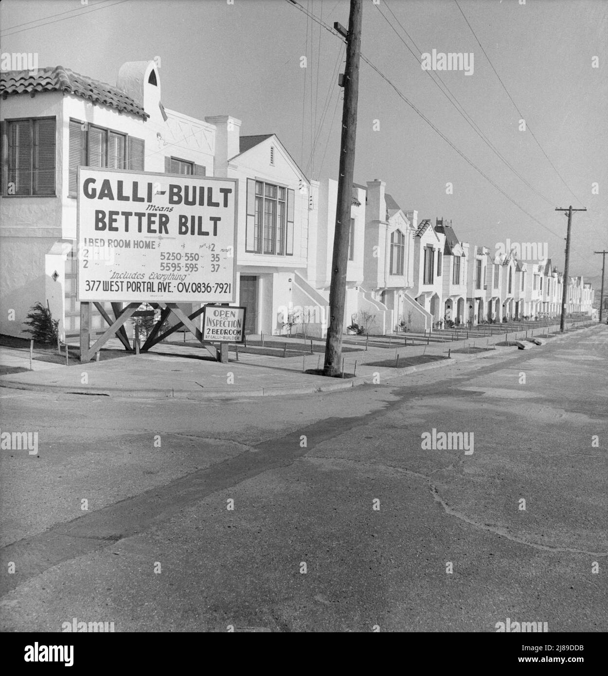 Note on modern architecture and home building. San Francisco, California. [Sign: 'Galli-Built means Better Bilt' - 1- and 2-bedroom houses for sale: &quot;Includes Everything&quot; - 'Open for Inspection - 2 Bedroom - R.F. Galli - Builder']. Stock Photo