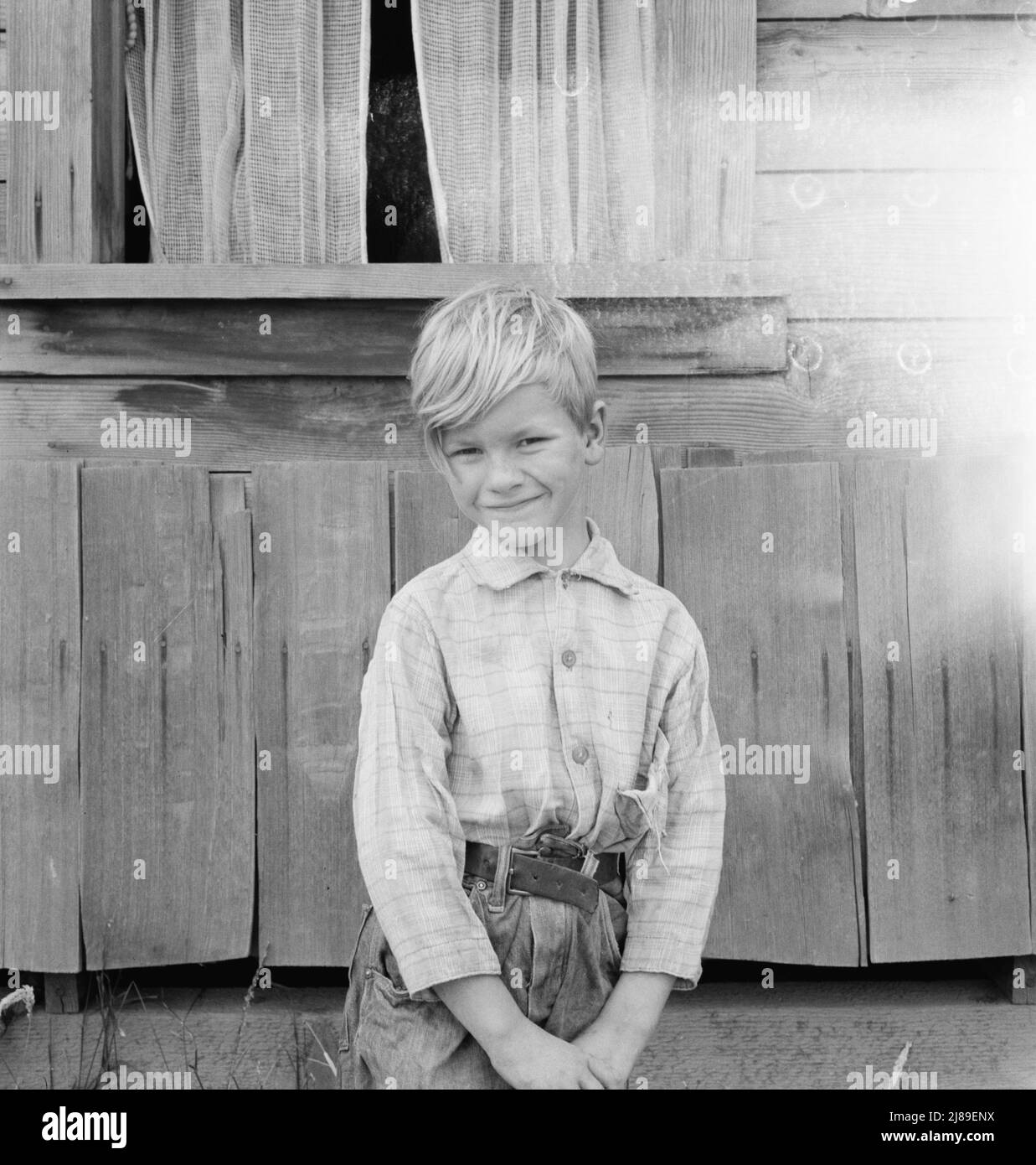 The youngest Arnold boy who also works at land clearing. Western Washington, Thurston County, Michigan Hill. See general caption number 36. Stock Photo