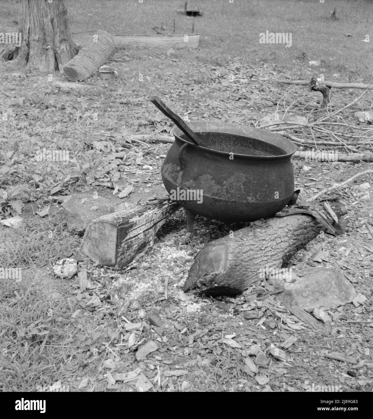 Iron pot for heating water stands out in the yard of Negro tobacco