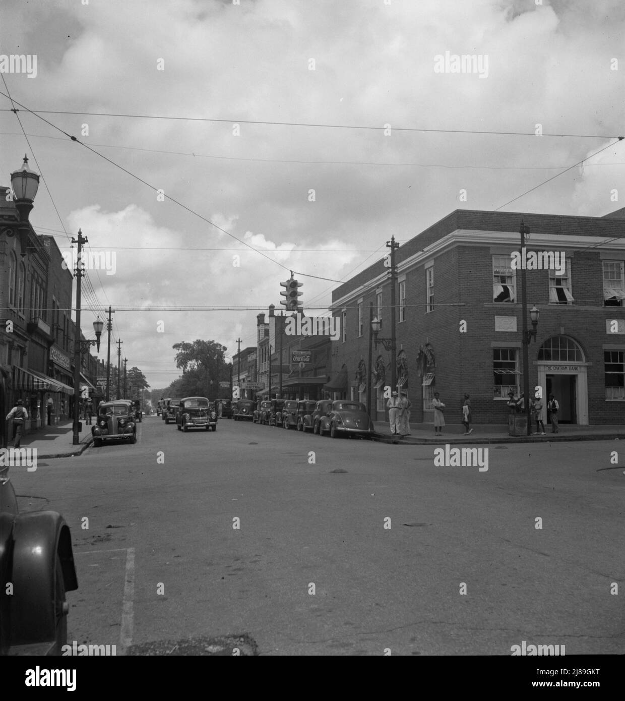 The main street, Fayetteville Street, of Siler City, North Carolina. Contrast with picture of same scene taken twenty five years ago. [The Chatham Bank on the right]. Stock Photo