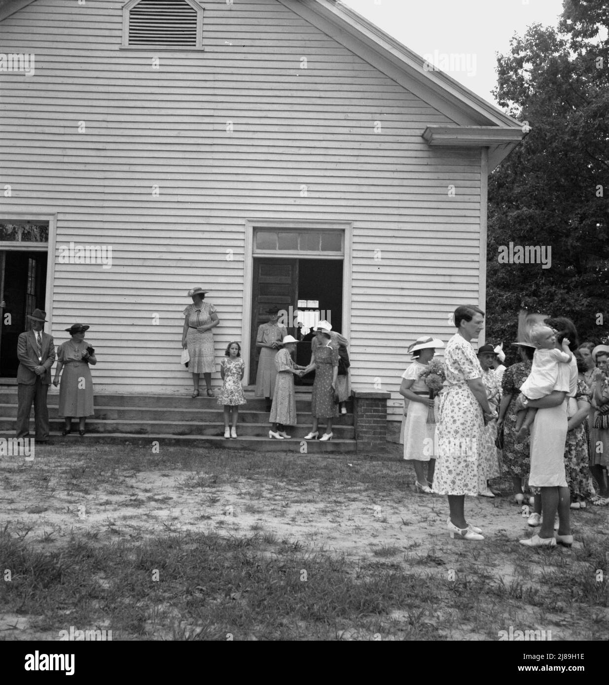 Congregation entering church. Wheeley's Church. Person County, North Carolina]. Stock Photo