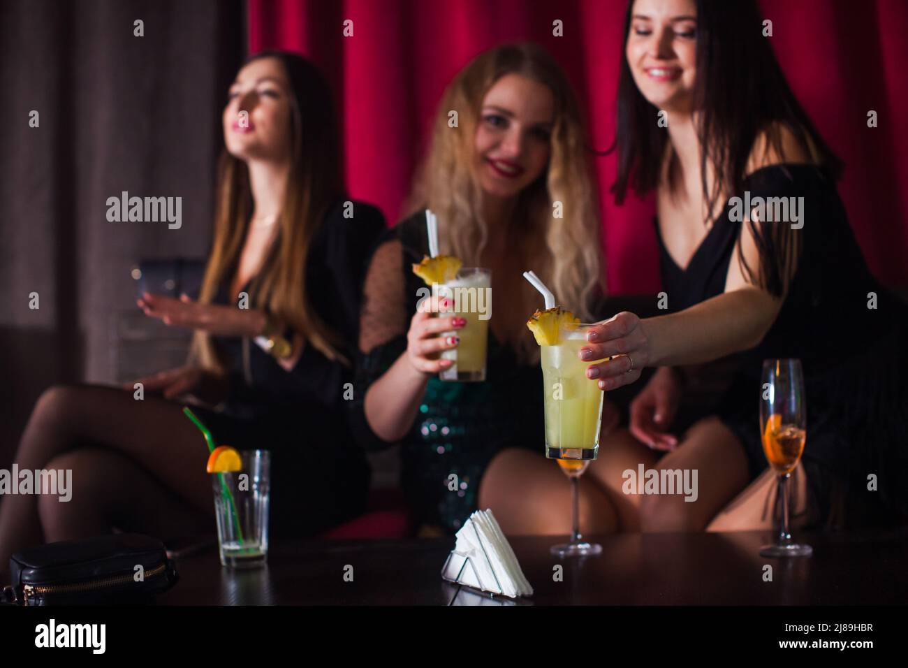 Women have fun and drinking cocktails with fruits Stock Photo Alamy